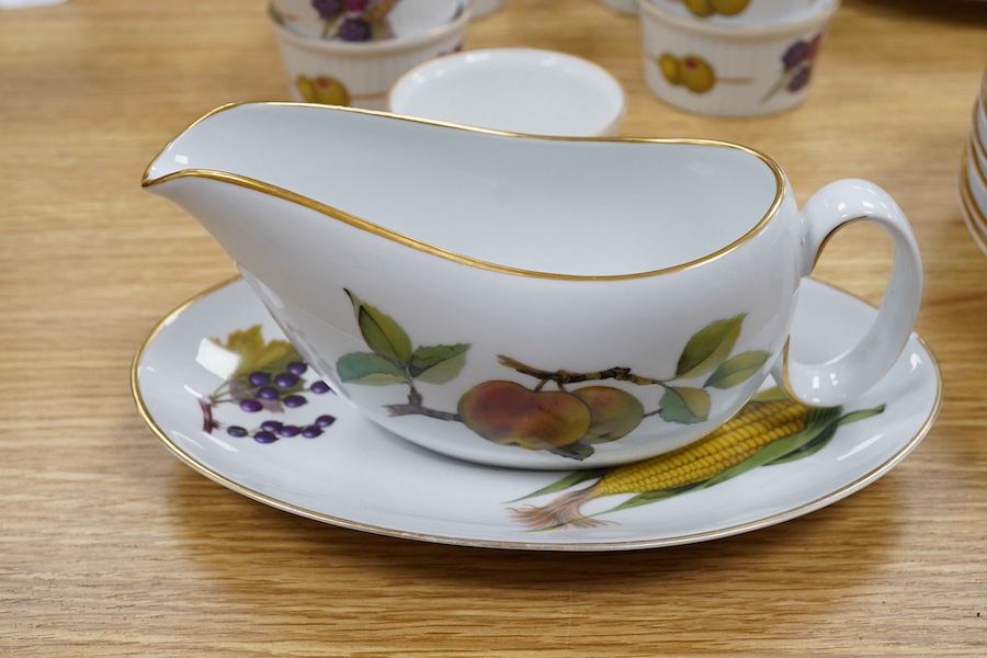 A Royal Worcester Evesham pattern dinnerware to include dinner plates, soup bowls and ramekins, largest 25cm in diameter. Condition - mostly good